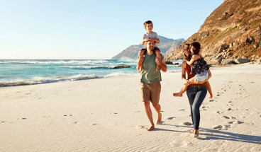 family on beach 767x418